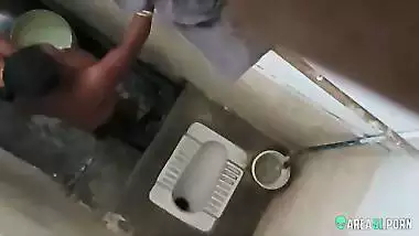 XXX clip of village aunty taking bath in outdoor taken on her son