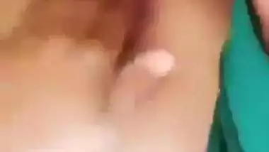 Horny girl squeezes her boobs and fingers her hairy pussy