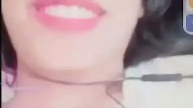 Smiling girlfriend video call to boyfriend shows boobs